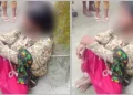 Woman tied to tree