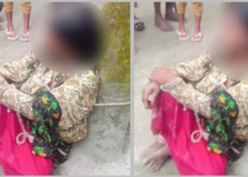 Woman tied to tree