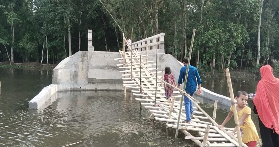 Tk 10.5 Million Bridge Stands Completed, But Bamboo Footbridge Remains Only Access for 20,000 Residents